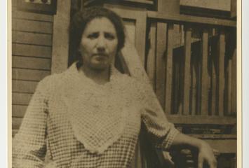 Flora Wembren Selesnick in front of Selesnick Family home on Watts Street in Chelsea, undated. Sterling and Selesnick Family Papers; P-1040; box 1; folder 6; Wyner Family Jewish Heritage Center at NEHGS, Boston, Mass.