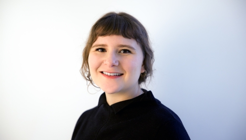 Image of Sarah Quiat, wearing black shirt with hair back.