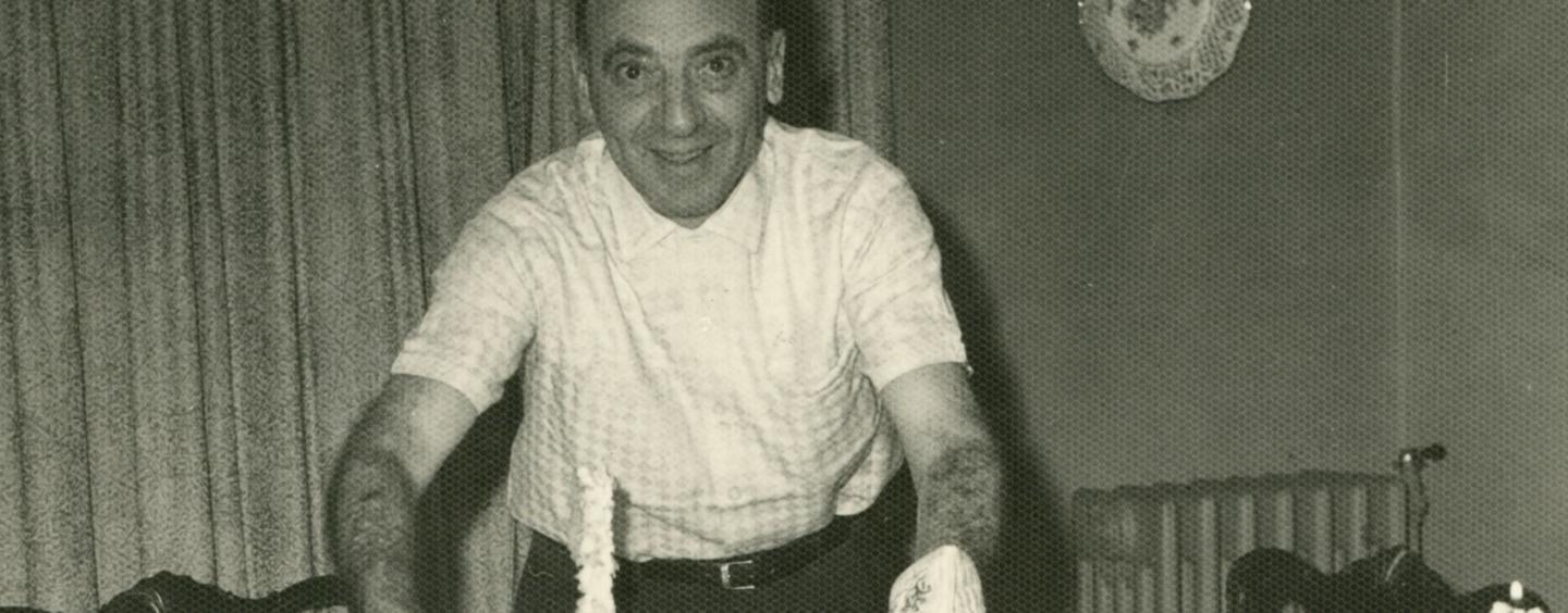 Jack Fox serving dinner, circa 1950s, Jewish Neighborhood Voices collection in the JHC archive.