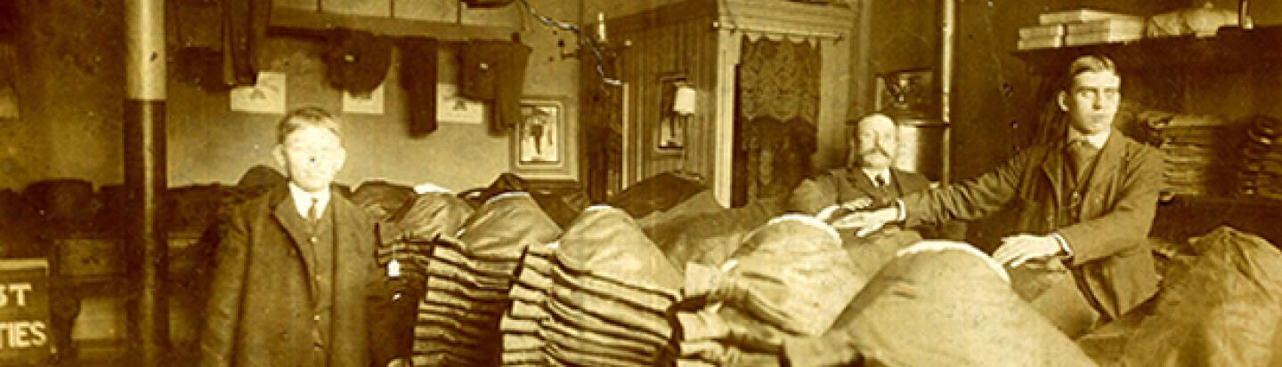 Black and white photograph of two men in a large room
