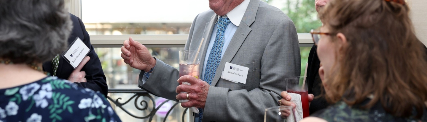 JHC Benefit Dinner | Talking and laughing group